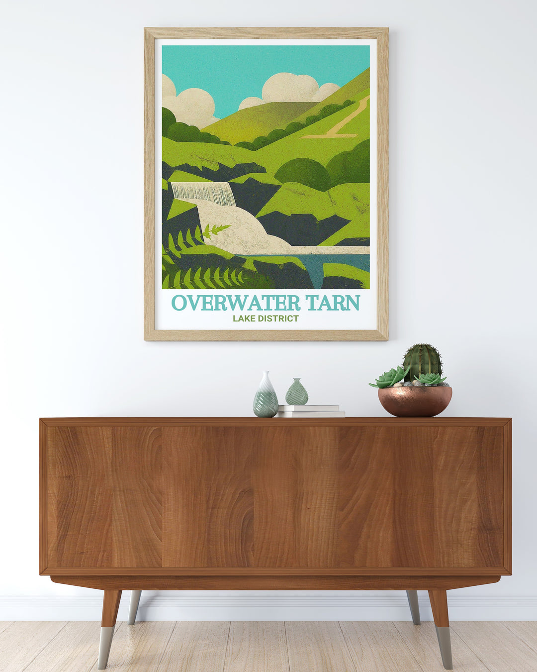 Lake District travel poster showcasing the serene waters of Overwater Tarn and the cascading beauty of Dash Falls. This print brings the charm of Cumbrias natural beauty into your space, perfect for decorating living rooms, offices, or bedrooms. An ideal gift for nature lovers.