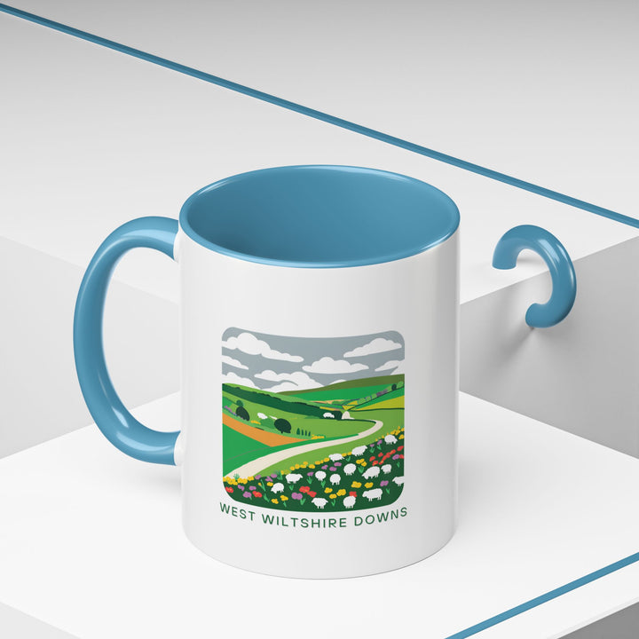 Enjoy the allure of the West Wiltshire Downs with this artistic mug featuring detailed illustrations of its iconic sights and natural beauty. Durable and dishwasher-safe, ideal for coffee or tea lovers and makes a meaningful gift for travelers and art enthusiasts.