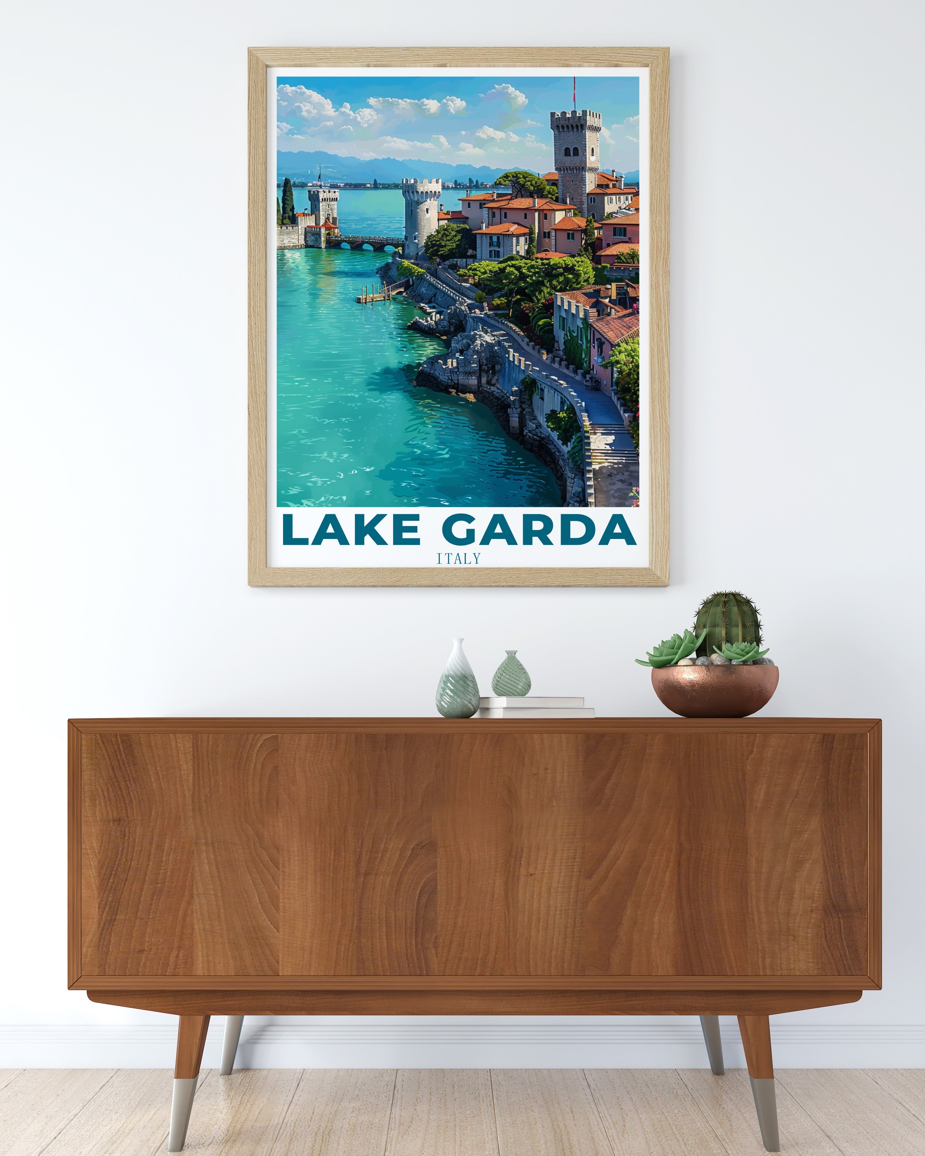 Framed Lake Garda prints and lago di garda poster art displayed on a white wall — MapYourDreams Italian lake wall art collection in natural wood and black frames, showing Sirmione, Limone sul Garda and Riva del Garda designs