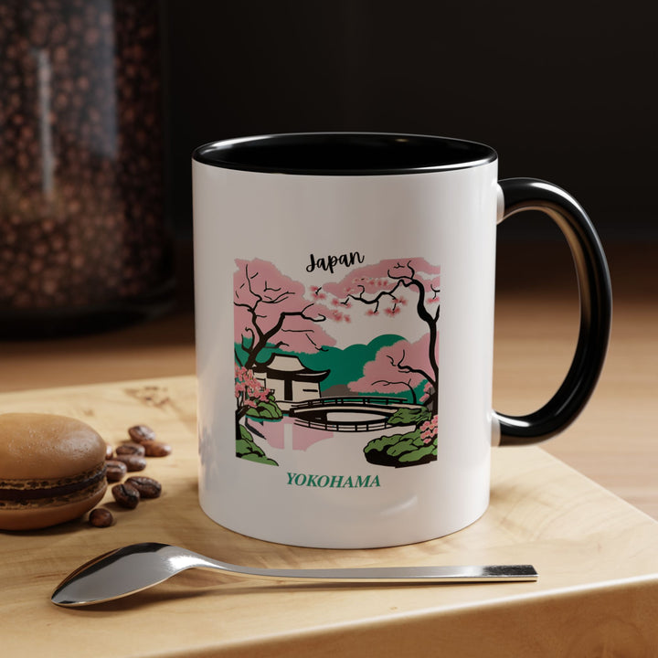 This Yokohama Japan mug combines practical function with artistic beauty, displaying intricate artwork of the citys vibrant culture. Made from durable ceramic, it is dishwasher and microwave safe. An excellent gift or keepsake for travelers and coffee enthusiasts.