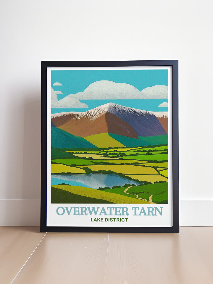 Skiddaw art print featuring the majestic beauty of Skiddaw and Overwater Tarn. This detailed artwork highlights the towering peaks and the serene tarn, ideal for adding a touch of natural beauty to any room. Perfect for outdoor lovers.