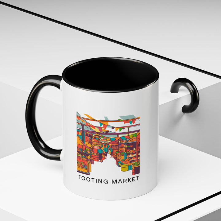 A premium Tooting Market mug displaying the markets vibrant scenes in stunning detail. Made from durable ceramic, dishwasher and microwave safe, it combines functionality with artistic expression, enhancing your beverage experience with a touch of Londons charm.