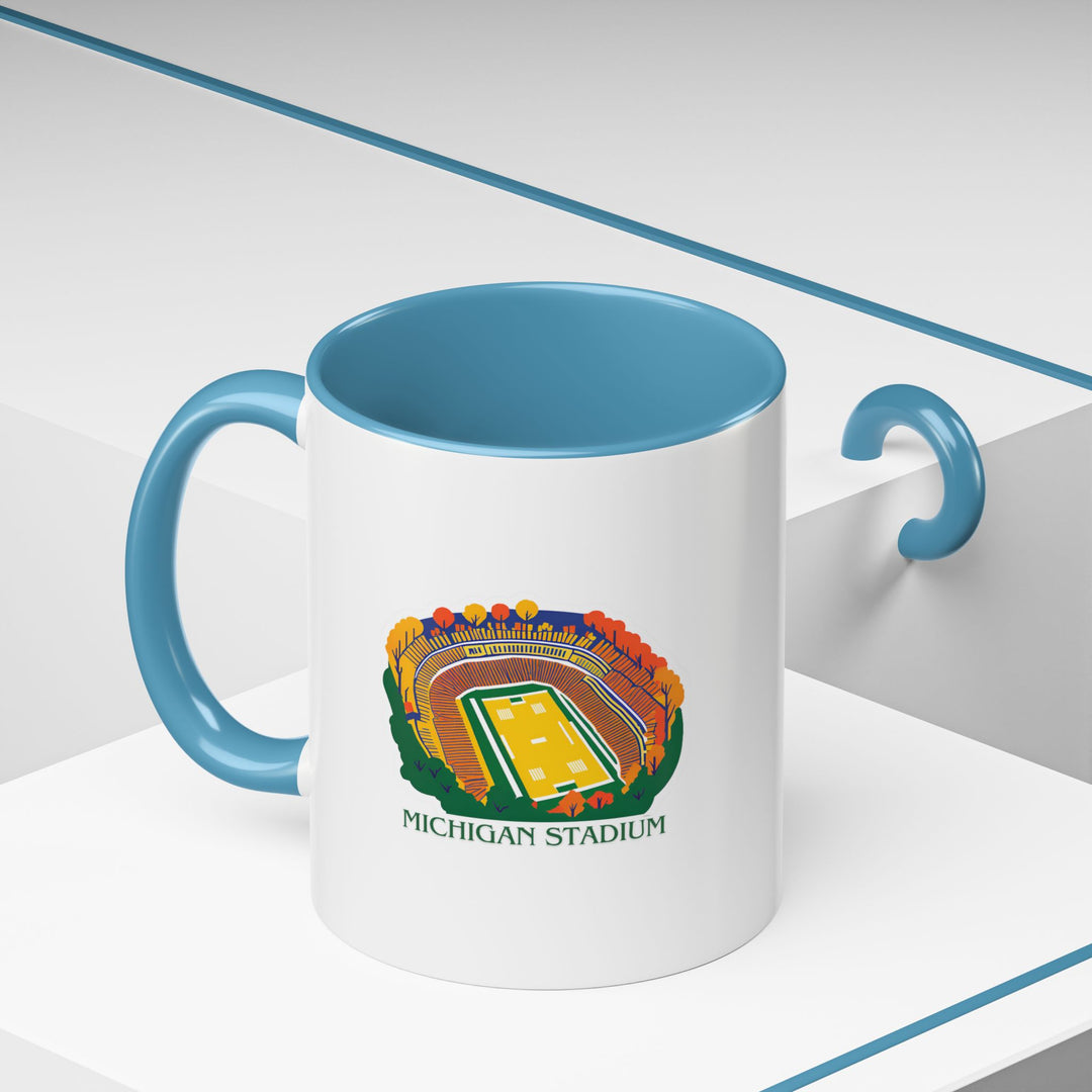 A durable Michigan Stadium mug crafted from ceramic, featuring artwork inspired by Michigan’s iconic venue. Microwave-safe, dishwasher-friendly, and ideal for everyday use or as a keepsake.