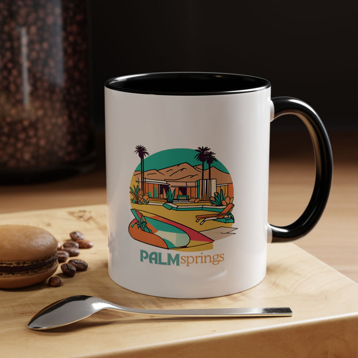 A beautifully crafted Palm Springs mug featuring intricate artwork inspired by Palm Springs’ iconic mid-century modern architecture and serene desert landscapes. Made from durable ceramic, this mug is dishwasher and microwave safe, perfect for coffee and tea lovers who appreciate southwestern elegance.