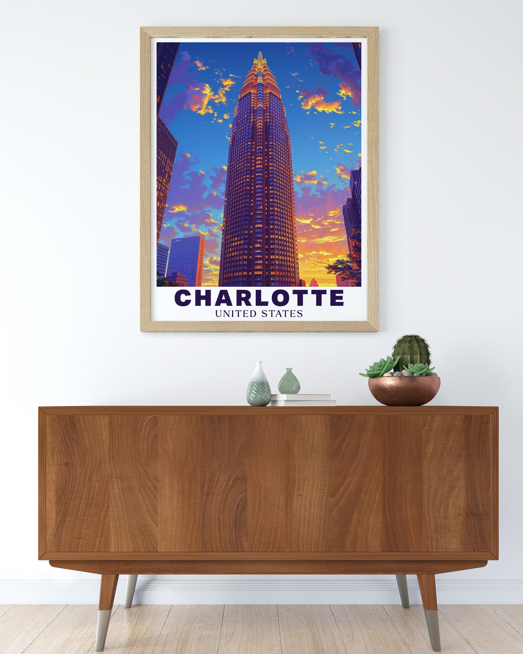 Our Charlotte wall print showcases the sleek, modern architecture of the Bank of America Corporate Center, a defining feature of the citys skyline. This travel print brings the heart of the city into your home, offering a bold and contemporary addition to your decor. Perfect for those who admire urban landscapes and elegant design.