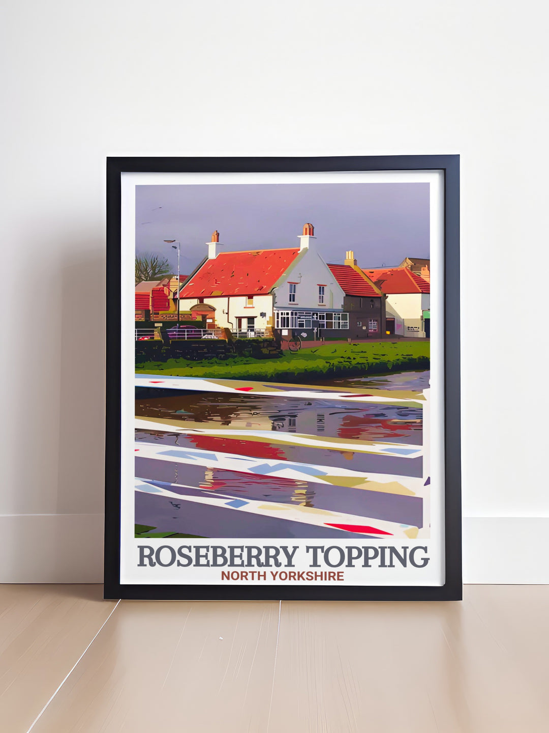 This Roseberry Topping travel print highlights the distinctive peak alongside the historical village of Great Ayton, nestled within the North York Moors. A perfect piece for adventurers and history buffs.