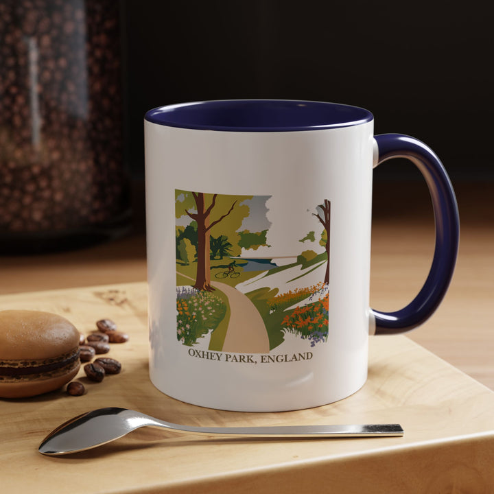 This Oxhey Park England mug is a tribute to the peaceful beauty of one of England’s most cherished parks. With detailed artwork capturing the park’s landscapes, this mug is perfect for enjoying your favorite hot drinks. Dishwasher and microwave safe.