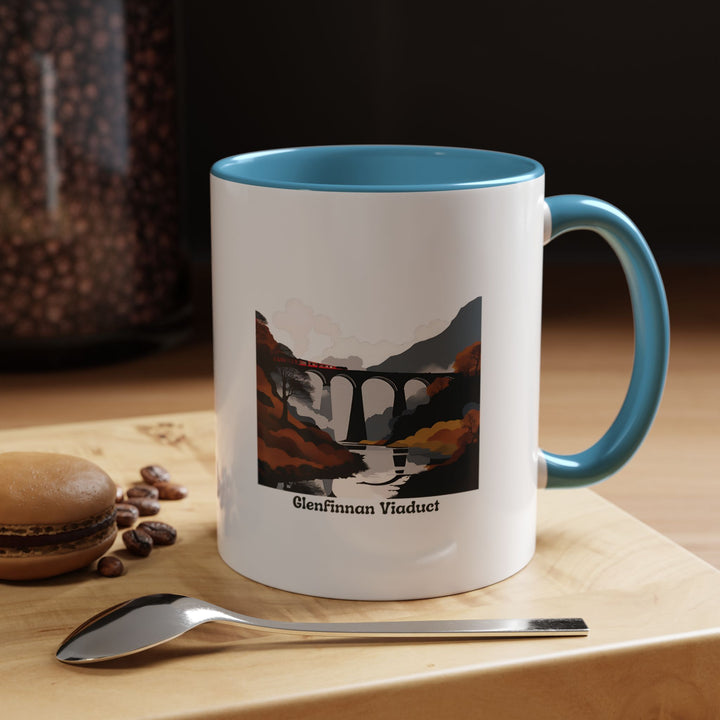 This Glenfinnan Viaduct mug captures the charm of Scotland's Highlands with vivid artwork. Crafted from ceramic, it is both dishwasher-safe and microwave-safe, offering style and practicality for tea, coffee, or other beverages.