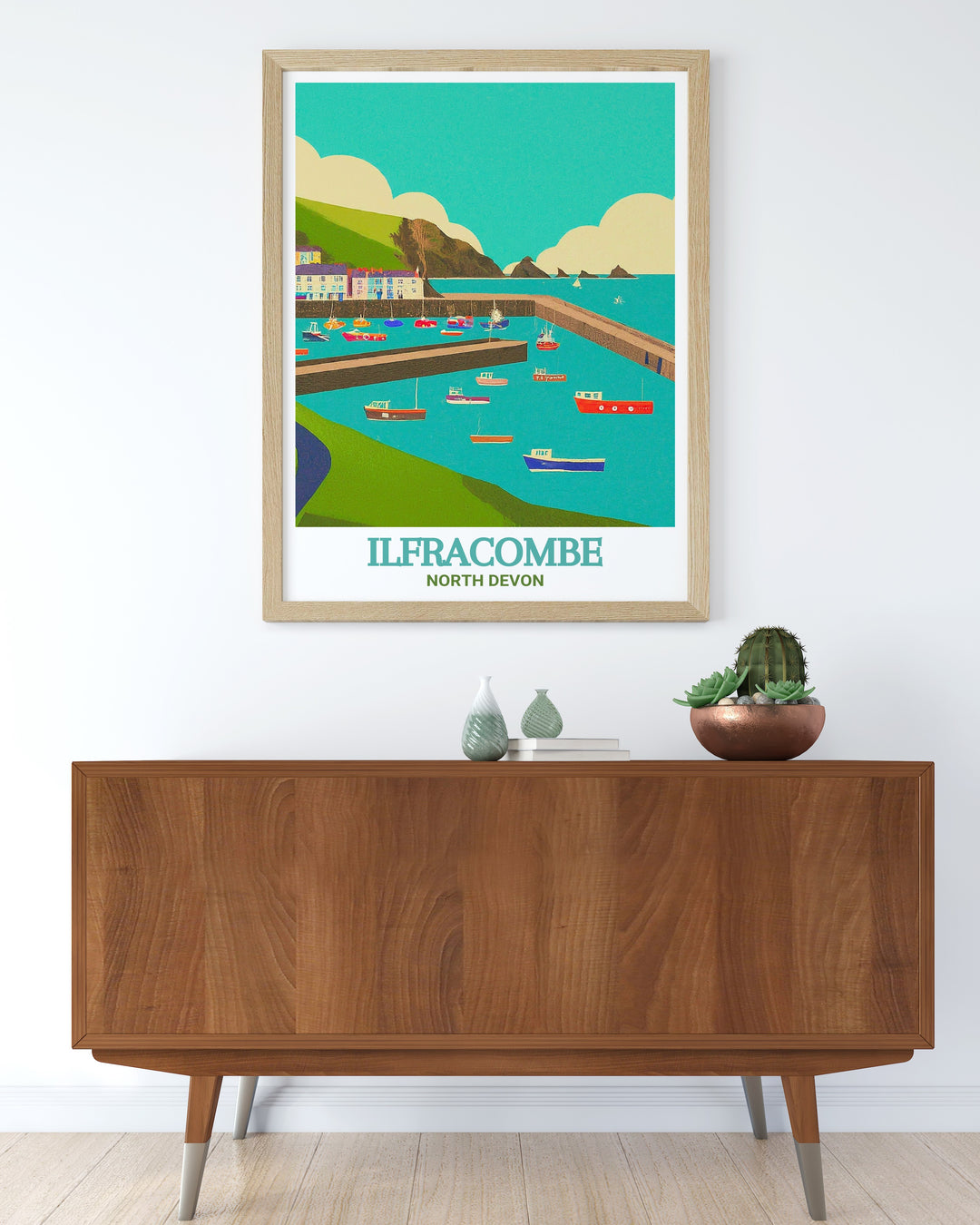 A framed art print of Ilfracombe, Devon, showcasing the towns beautiful harbor and the surrounding scenery. Perfect for adding a touch of coastal elegance to any room in your home.