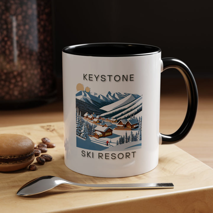 Add Keystone’s alpine charm to your daily routine with this ceramic mug. Featuring intricate designs inspired by the ski resort’s beauty, it is dishwasher-safe and perfect for coffee or tea lovers. A thoughtful keepsake for travelers and skiers.