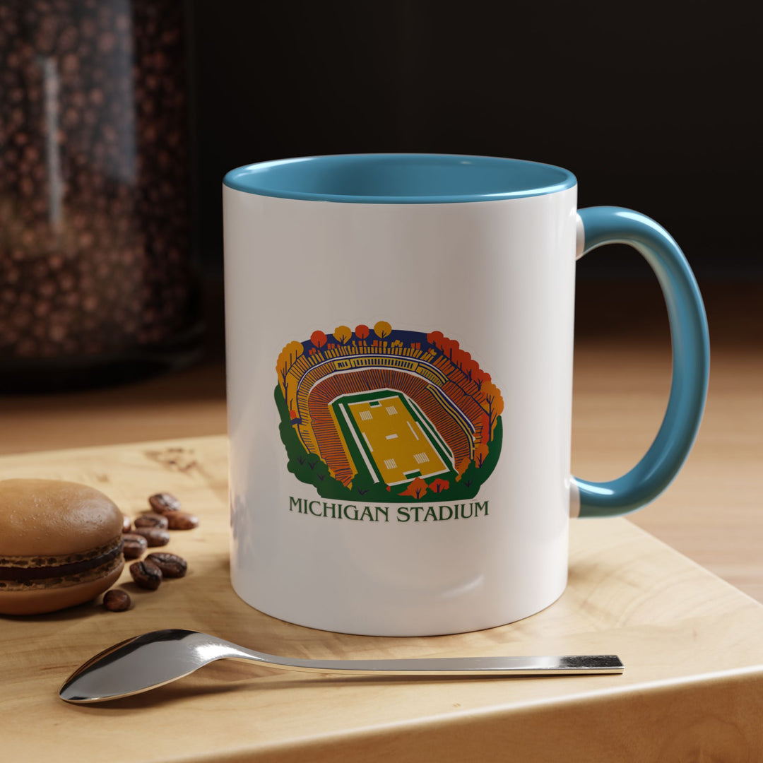 Bring Michigan pride to your mornings with this ceramic Michigan Stadium mug. Featuring vibrant artwork, it is dishwasher-safe and microwave-friendly, making it ideal for sports enthusiasts and collectors alike.