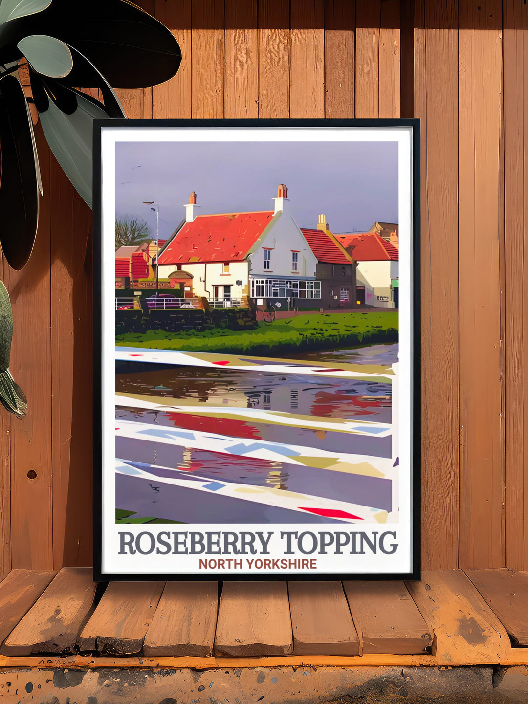 This Roseberry Topping travel poster captures the iconic peak of North Yorkshire alongside the historical village of Great Ayton. Perfect for outdoor enthusiasts and history lovers, this wall art celebrates the stunning landscapes of the North York Moors.