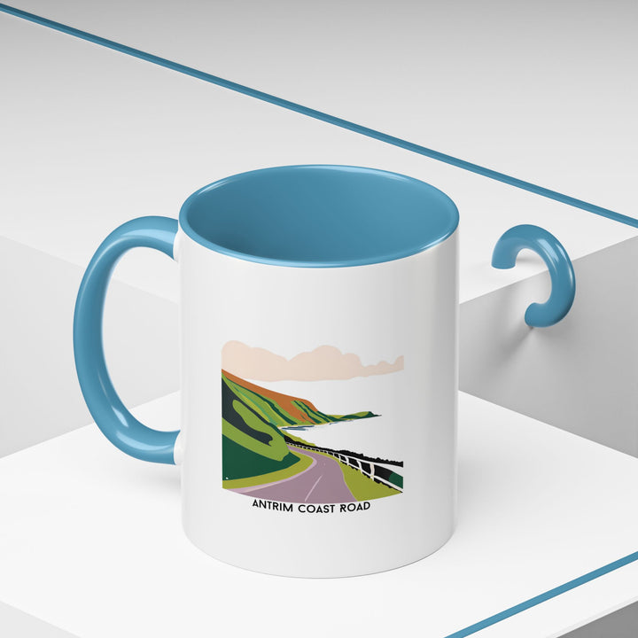 A stylish Antrim Coast Road mug showcasing iconic Irish coastal landscapes. Dishwasher- and microwave-safe ceramic construction ensures long-lasting use, while its vibrant design makes it perfect for gifting or personal enjoyment.