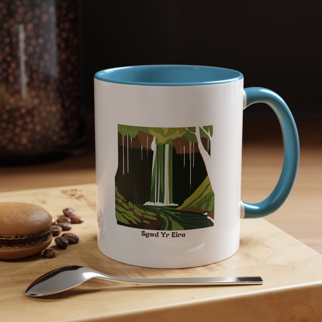 The Sgwd Yr Eira Waterfall Mug showcases stunning artwork of the Brecon Beacons waterfall. Made from high-quality ceramic, it is dishwasher-safe and microwave-safe, making it an excellent gift or keepsake for nature enthusiasts.