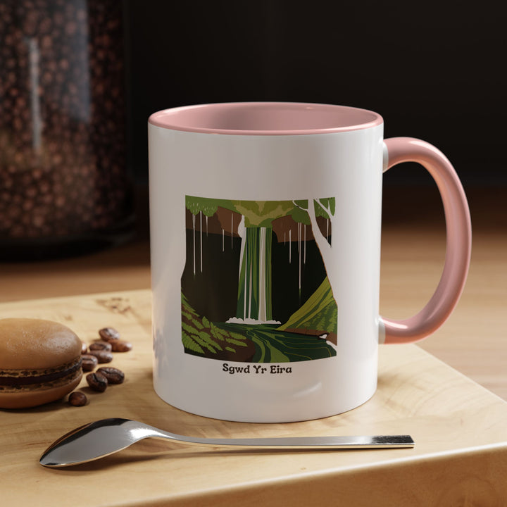 A ceramic Sgwd Yr Eira Waterfall Mug that captures the beauty of Wales's famous cascade. Dishwasher-safe and microwave-safe, it is ideal for coffee or tea and serves as a memorable souvenir.