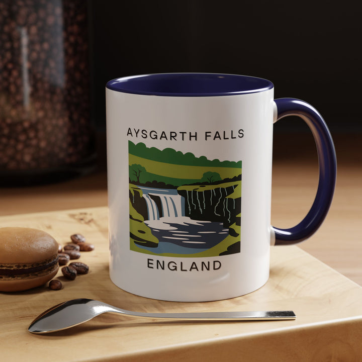 A beautifully designed Aysgarth Falls England mug showcasing the natural beauty of Aysgarth Falls. Perfect for coffee or tea lovers, it features vibrant artwork of the iconic waterfall. Dishwasher and microwave safe, this mug makes an ideal gift or keepsake for travelers.