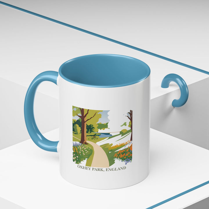 A stunning Oxhey Park England mug designed to showcase the park’s scenic beauty. This mug is perfect for coffee and tea lovers and makes a great gift for nature lovers. Dishwasher and microwave safe for easy care.