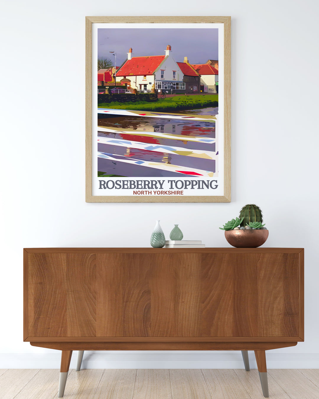 Showcasing the rugged beauty of Roseberry Topping and the historical significance of Great Ayton, this wall art is ideal for outdoor enthusiasts and history lovers. The print captures the unique landscape of the North York Moors.