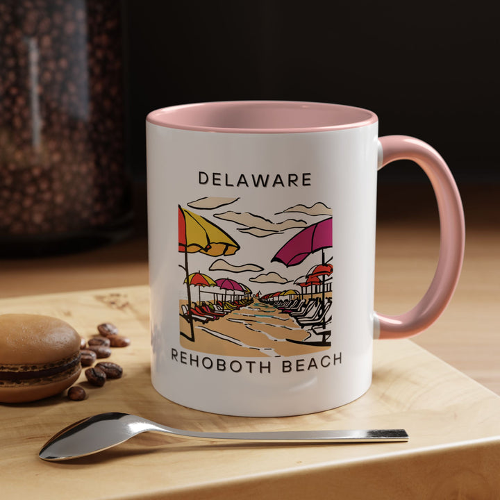 The Rehoboth Beach mug is a perfect way to enjoy your coffee or tea while celebrating the beauty of this coastal town. Made of durable ceramic, it features vibrant beach-themed artwork and is dishwasher and microwave safe, perfect for everyday enjoyment.