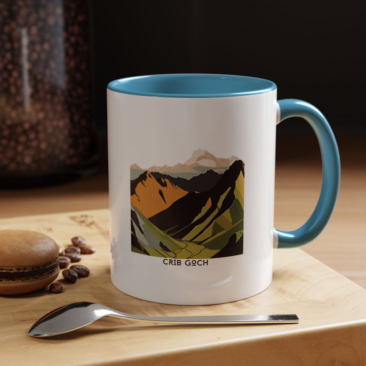 A beautifully crafted Crib Goch mug featuring detailed artwork inspired by Snowdonia’s iconic ridge. Made from durable ceramic, it is dishwasher and microwave safe, making it perfect for coffee lovers or as a thoughtful gift for hiking enthusiasts and nature lovers. .