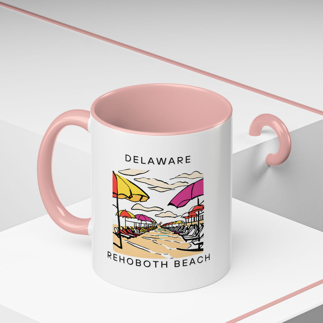 Sip your favorite beverage from this vibrant Rehoboth Beach mug. Featuring artwork inspired by the beauty of the beach, it’s perfect for those who appreciate coastal living. Dishwasher and microwave safe, this mug makes a thoughtful gift for beach lovers.