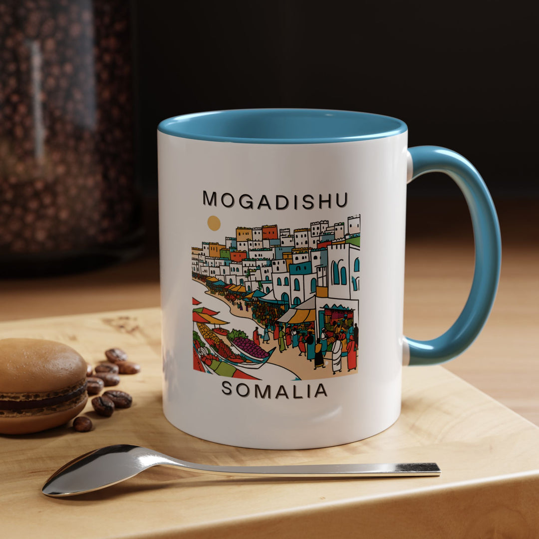 Celebrate the beauty of Mogadishu with this elegant mug showcasing intricate artwork of the city. Perfect for enjoying coffee or tea, this durable ceramic mug is both dishwasher and microwave safe, making it a thoughtful gift for those who love Somalia.