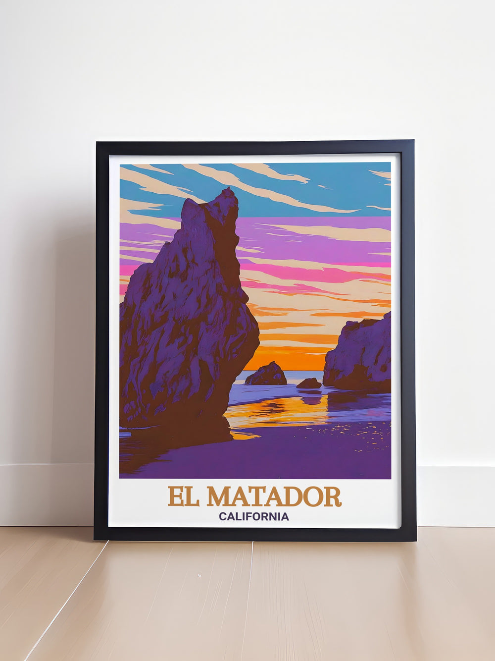 Stunning Sunsets Travel Print captures the warm hues of a sunset over Californias El Matador Beach. This wall art offers a breathtaking view of the Pacific Ocean and the famous sea caves, perfect for coastal decor and art lovers alike.