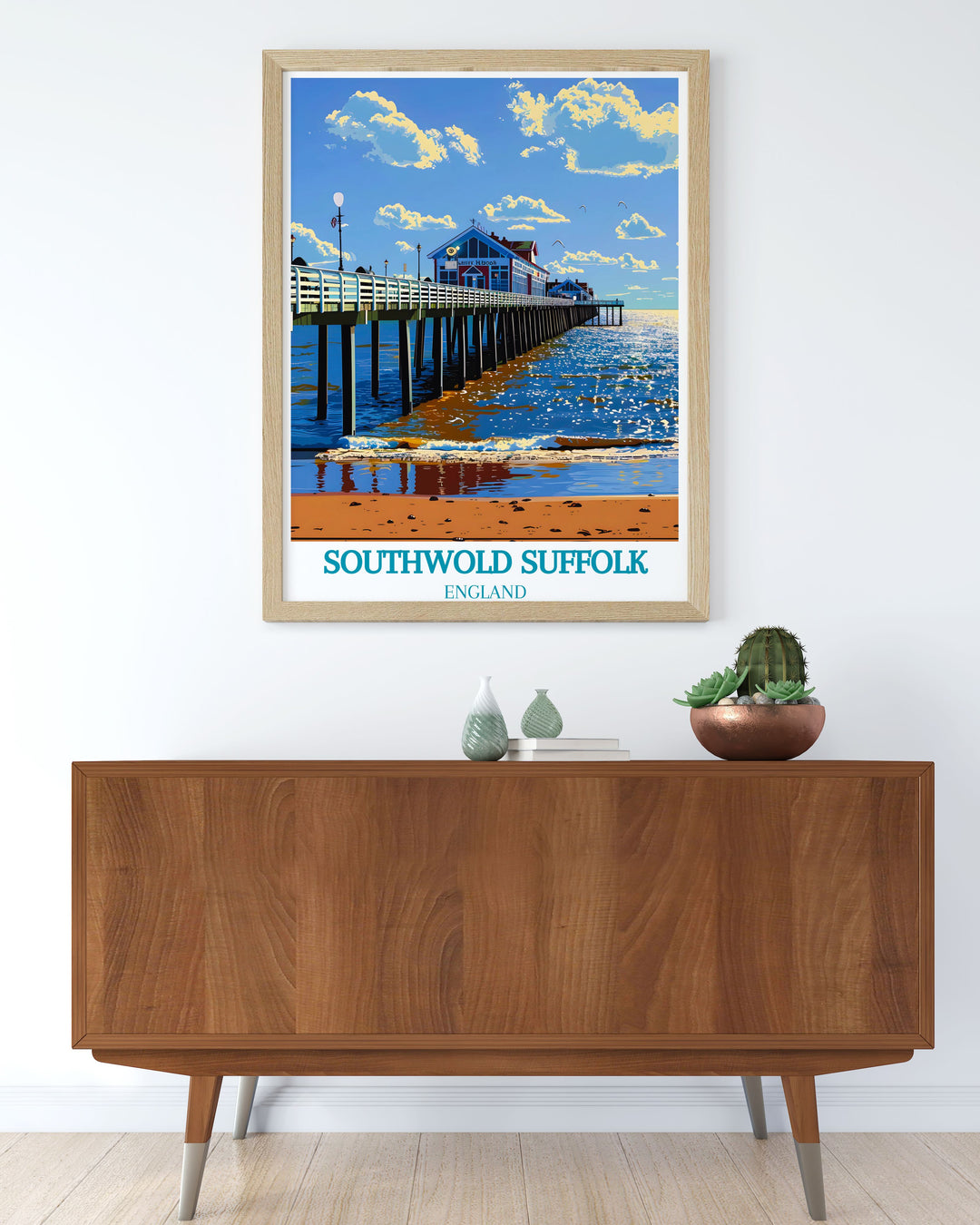 Capture the essence of Southwolds seaside charm with this art print, highlighting the traditional pier and the surrounding coastal beauty.