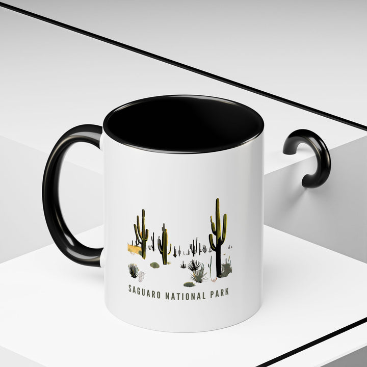 Celebrate your love for Saguaro National Park with this artistic ceramic mug. Featuring detailed designs of iconic saguaro cacti, it is microwave and dishwasher safe. Ideal for daily use or as a meaningful gift for nature enthusiasts and collectors.