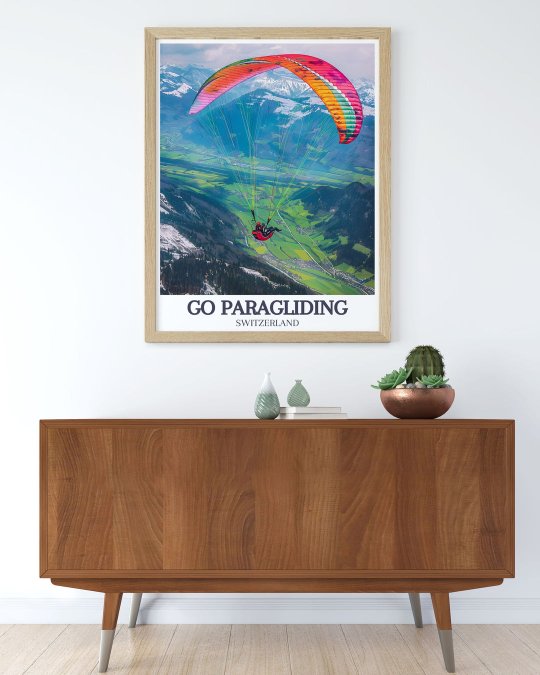 Framed art print illustrating the majestic peaks of Jungfrau as a paraglider soars above, capturing the essence of alpine adventure and natural beauty.
