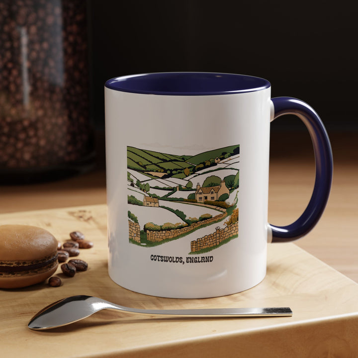 A ceramic Cotswolds England mug celebrating the beauty of the English countryside. Featuring elegant designs, it is dishwasher safe and perfect for coffee lovers or as a thoughtful souvenir for travelers who cherish the charm of the Cotswolds.