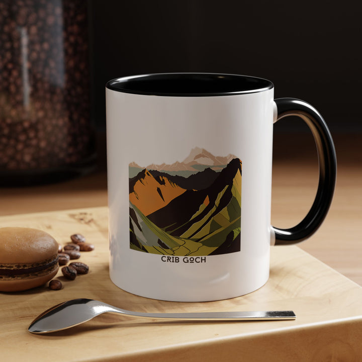 Celebrate the adventurous spirit of Snowdonia with this Crib Goch mug. Featuring vibrant ridge artwork, it is crafted from durable ceramic and dishwasher safe, making it perfect for coffee lovers or as a unique souvenir for travelers.