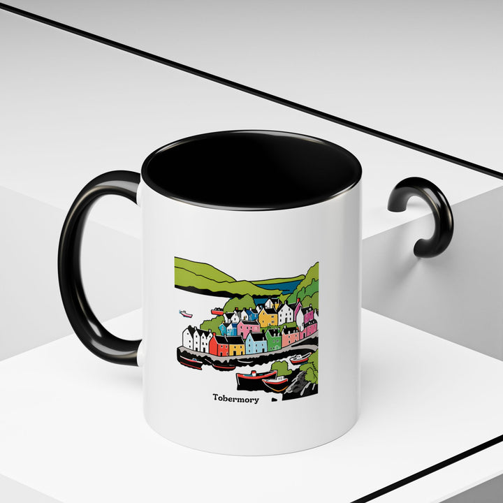 This Tobermory mug features vibrant artwork that captures the essence of the coastal town. The ceramic 11oz mug is durable, microwave safe, and dishwasher safe. A delightful gift for anyone who appreciates unique designs and high-quality mugs.