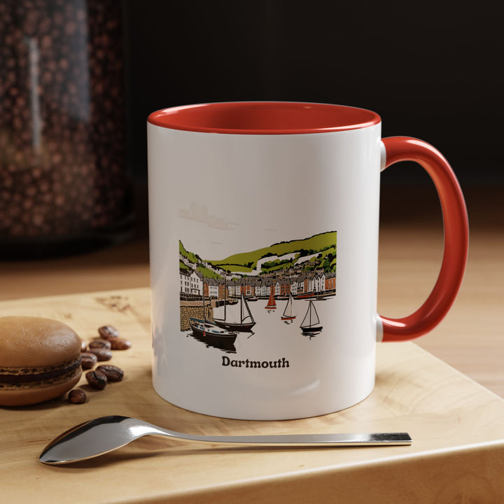 The Dartmouth Mug is a high-quality ceramic cup adorned with artistic designs celebrating the town’s beauty and culture. Dishwasher and microwave safe, this mug is ideal for daily use or as a thoughtful gift for Dartmouth fans.