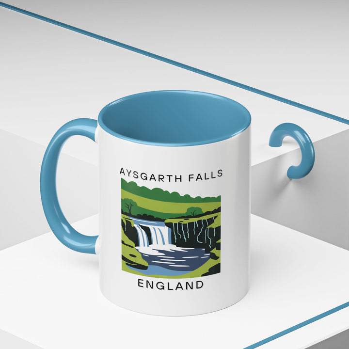 The Aysgarth Falls England mug beautifully captures the majestic waterfall in intricate artwork. Perfect for tea and coffee lovers, it is dishwasher safe and microwave safe, making it both practical and visually striking.