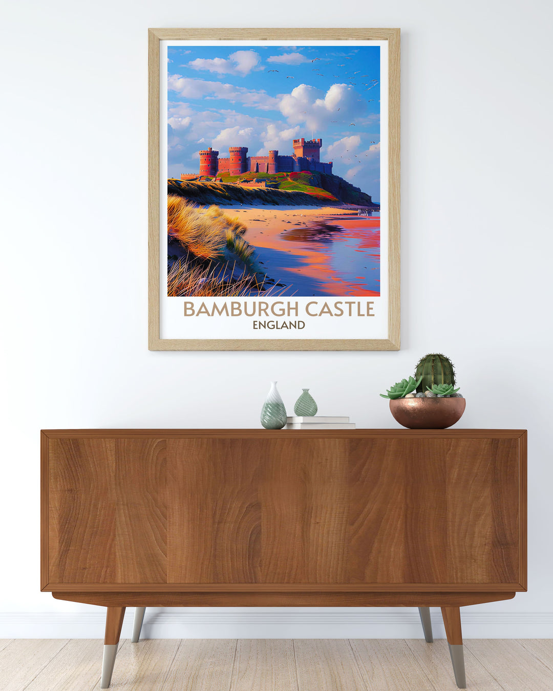 Retro travel poster of Bamburgh Castle with a view of the sandy shores and rugged coastline, printed on high quality archival paper.