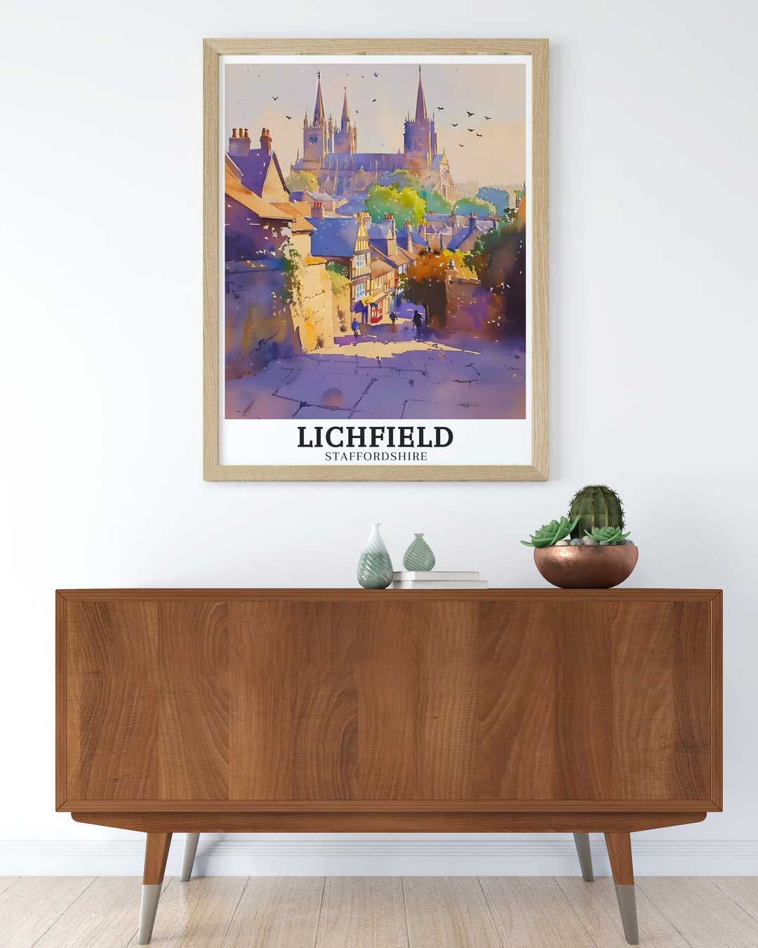 This Lichfield art print offers a stunning view of Lichfield Cathedral and its surrounding area, The Close. The detailed illustration of the cathedrals spires and the peaceful greenery make it a perfect addition for lovers of English history and architecture.