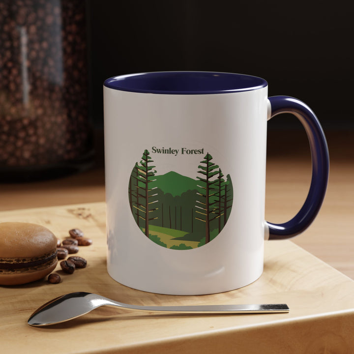 A beautifully designed Swinley Forest mug capturing the forests lush greenery. Perfect for coffee or tea lovers, it features vibrant artwork inspired by Swinley Forests natural beauty. Durable and dishwasher-safe, this mug is a meaningful gift or keepsake for nature enthusiasts and travelers.