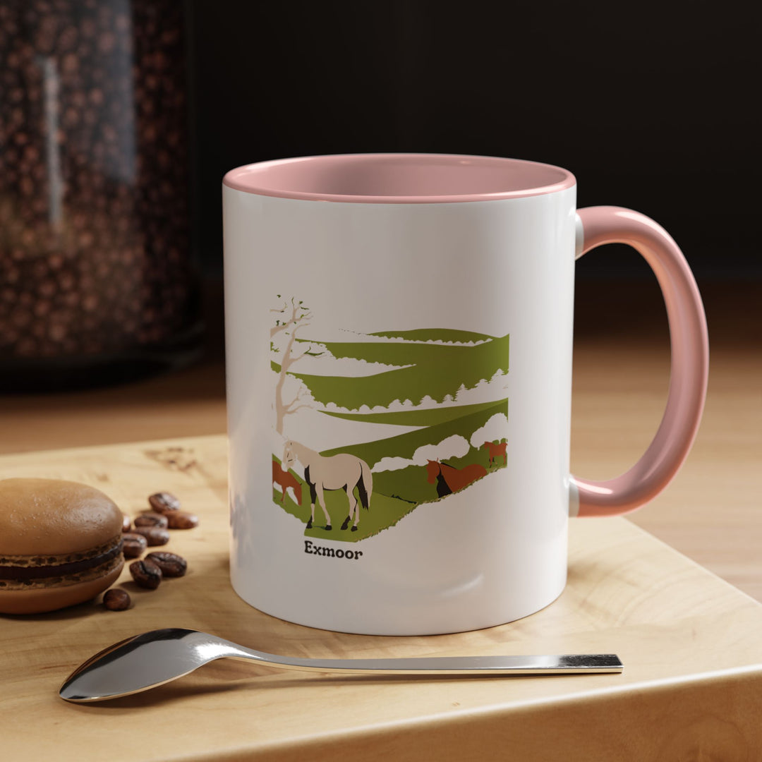 A ceramic Exmoor mug featuring vibrant designs of Exmoor landscapes. Perfect for hot drinks, it is dishwasher and microwave safe. Its colorful rim and interior enhance its artistic appeal, making it an ideal gift or addition to any collection.