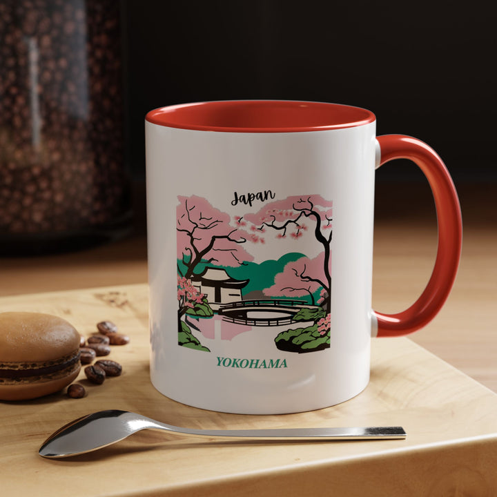 Enjoy your favorite beverage with this Yokohama Japan mug featuring artistic depictions of the citys architecture. Perfect for coffee and tea lovers, it is dishwasher and microwave safe. A durable, meaningful gift or keepsake for travelers and art enthusiasts.