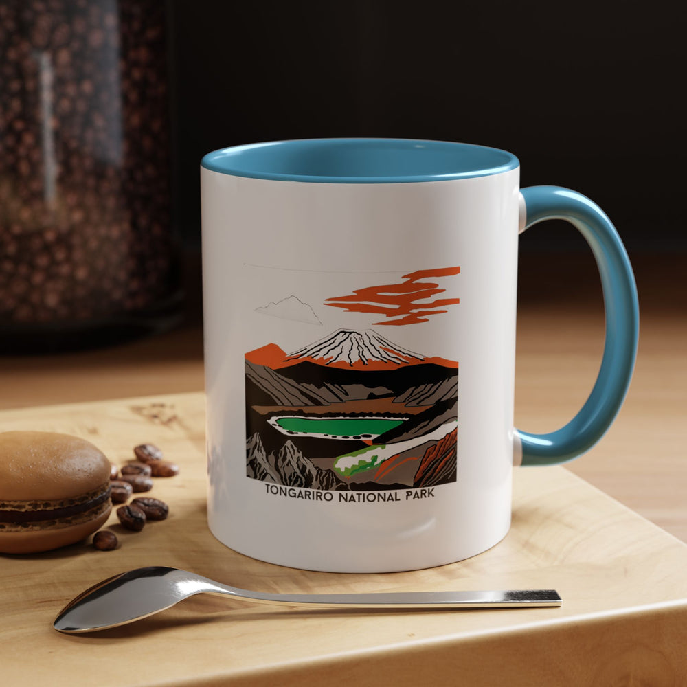 Experience the beauty of Tongariro National Park with this exquisite New Zealand mug showcasing detailed illustrations of the park's iconic landscapes. Ideal for hot beverages, this ceramic 11oz mug is microwave safe and dishwasher safe. A thoughtful gift for those who appreciate scenic beauty and artistic design.