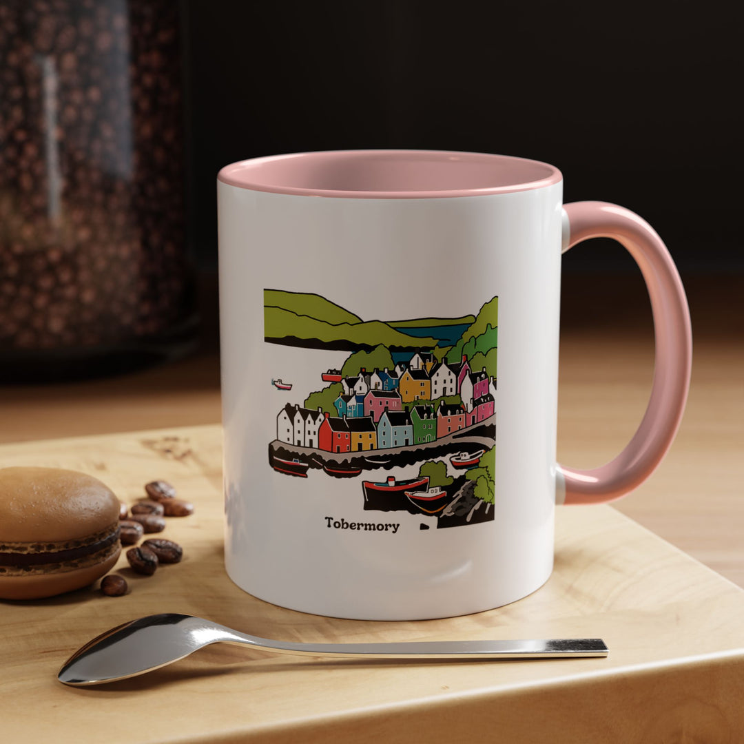 A stunning Tobermory mug designed by MapYourDreams, highlighting the unique beauty of the coastal town. This ceramic 11oz mug is microwave safe and dishwasher safe. An ideal gift for friends or family who appreciate art and scenic landscapes.