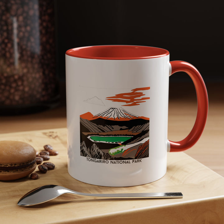 A beautifully designed Tongariro National Park New Zealand mug featuring vibrant artwork inspired by Tongariro's majestic mountains and serene lakes. Perfect for coffee or tea lovers, this durable ceramic mug is dishwasher safe and microwave safe. Ideal as a gift or keepsake for nature enthusiasts and art lovers.