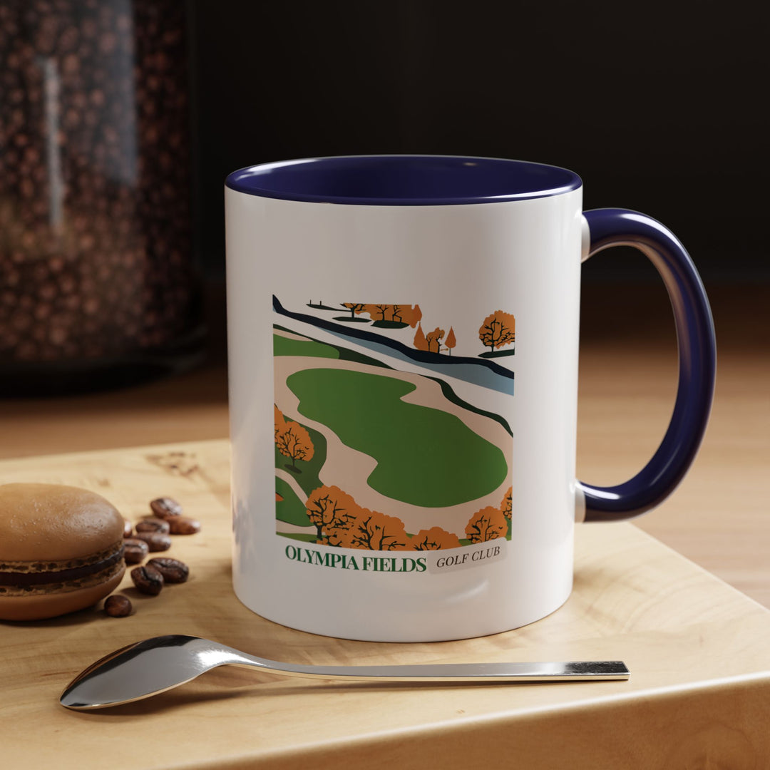 A beautifully crafted Olympia Fields Country Golf Club mug featuring intricate artwork of the club’s lush fairways and historic architecture. Made from durable ceramic, this mug is dishwasher and microwave safe, perfect for coffee and tea lovers who appreciate golf heritage.