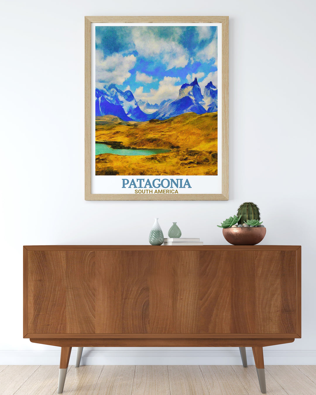 Framed print of Torres del Paine National Park with a view of the Cuernos Del Paine and grazing guanacos. Ideal for home decor and gifts. Adds a touch of elegance and adventure to any room.