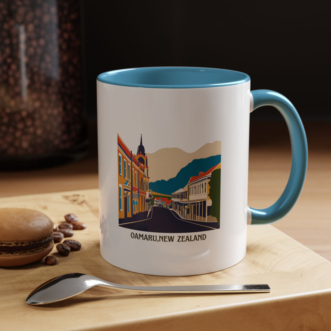 Celebrate the charm of Oamaru New Zealand with this elegant ceramic mug. Featuring detailed designs inspired by the town’s unique landmarks and stunning coastal views, it is dishwasher safe and microwave friendly, ideal for daily use or as a thoughtful gift for travel enthusiasts. s.