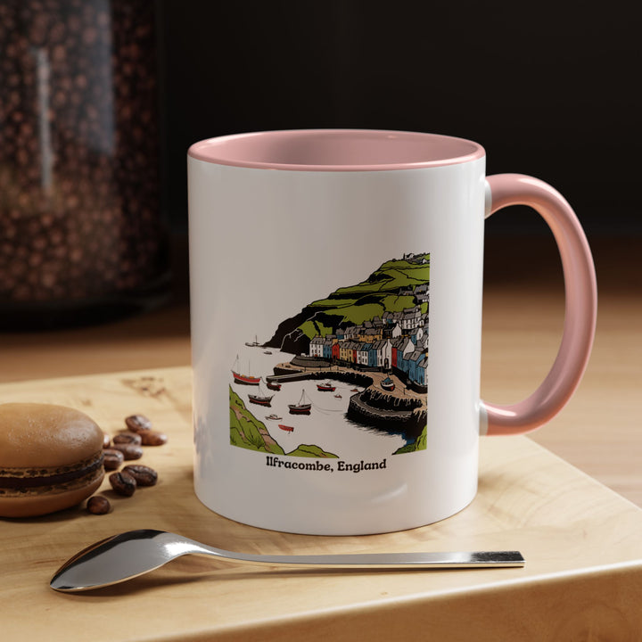 A colorful Ilfracombe England Mug featuring scenic views of the town’s harbor and natural beauty. Dishwasher and microwave safe, this ceramic mug is ideal for daily use or as a thoughtful gift for collectors.