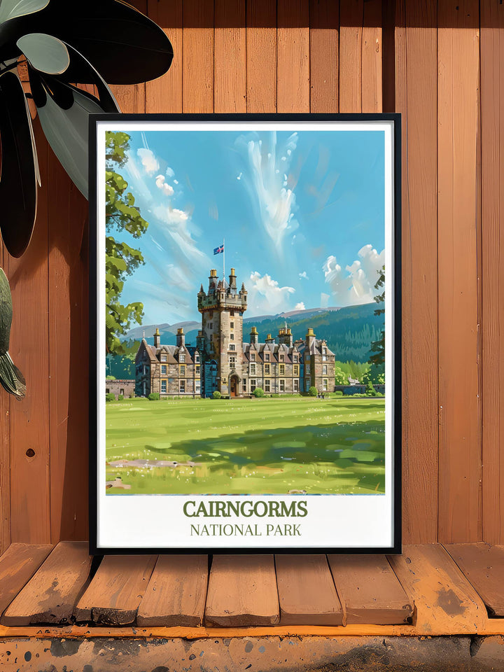 Vintage Travel Print of Balmoral Castle nestled in the heart of the Scottish countryside. The Cairngorms National Park provides a stunning backdrop, making this print a must have for lovers of Scotland.