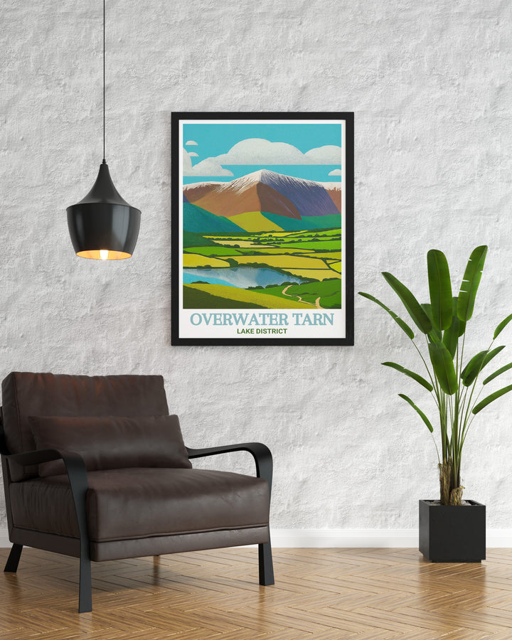 Overwater Tarn scenic poster highlighting the tranquil beauty of Cumbrias Lake District. This detailed artwork depicts the serene tarn and its lush surroundings, making it a perfect addition to your wall art collection. Ideal for those who love outdoor adventures.