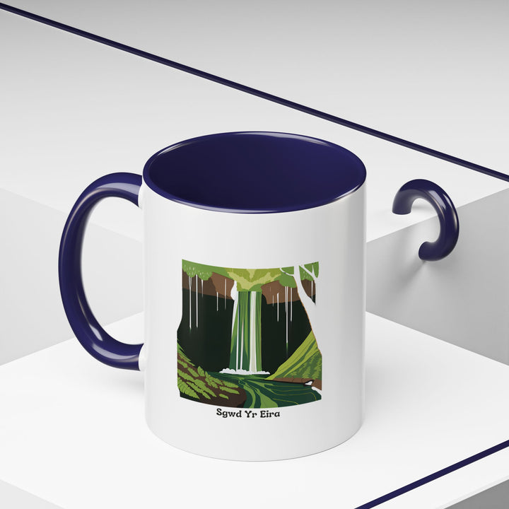 Capture the charm of Wales with the Sgwd Yr Eira Waterfall Mug. Featuring colorful artwork, it is dishwasher-safe, microwave-safe, and a great gift for nature and art enthusiasts.